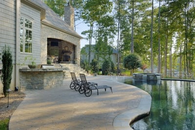 Stone patio with custom stone waterfall
