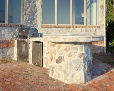 Custom stone counter with slide-in grill